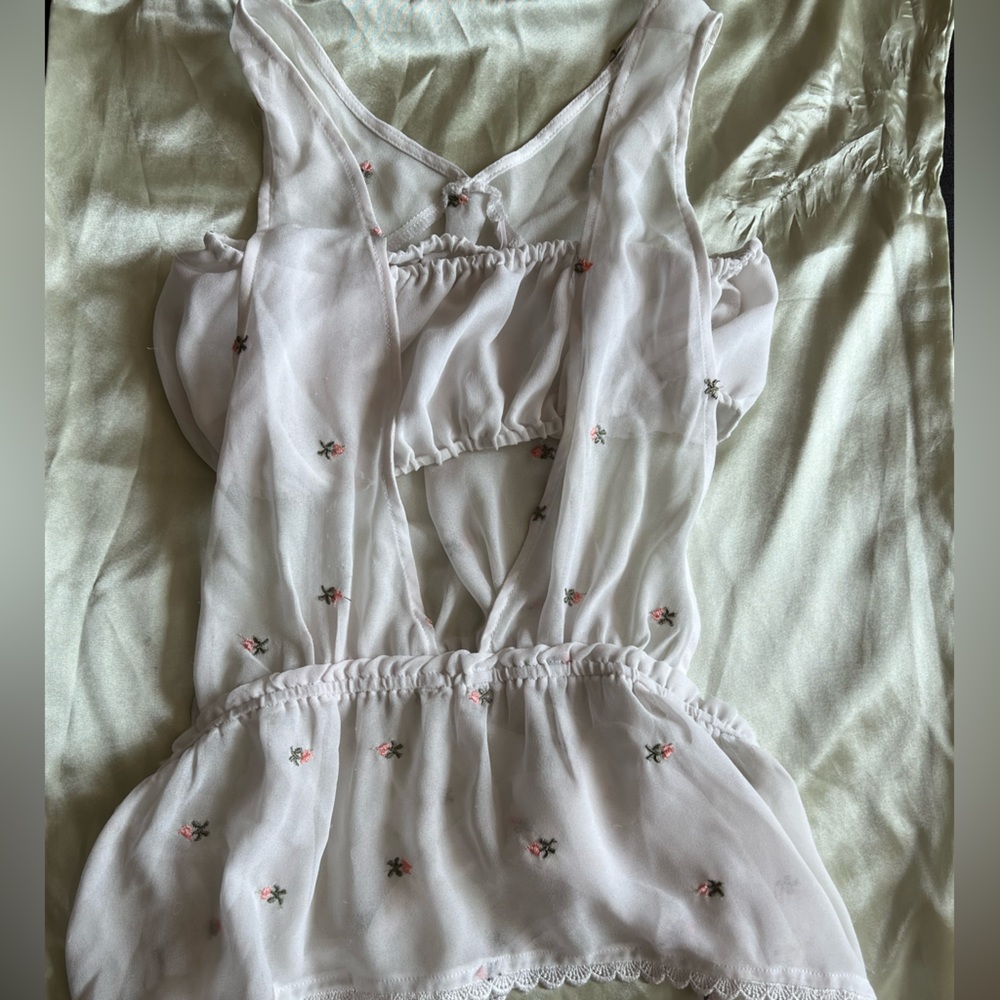 Honey Punch tank top. Partially sheer with flower detailing. Size medium.